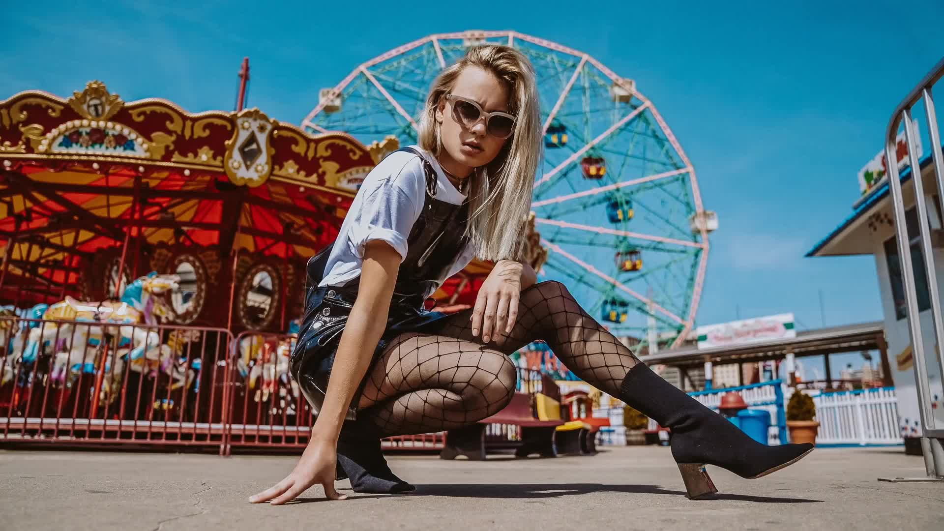 Blonde with sunglasses and fishnet stockings